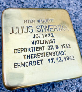 <p>HIER WIRKTE<br />
JULIUS STWERTKA<br />
JG. 1872<br />
VIOLINIST<br />
DEPORTIERT 27.8.1942<br />
THERESIENSTADT<br />
ERMORDET 17.12.1942</p>
